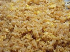 rice and eggs are mixed together in a bowl