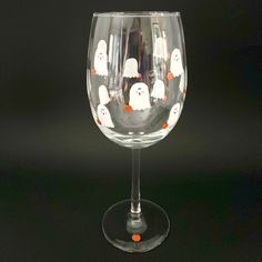 This cute Ghost wine glass has a small pumpkin and is a Halloween gift ready to give as a hostess or birthday gift!  There are 12 white ghosts and 12 little orange pumpkins that are hand painted on each glass.  Fall decor with a Minimalist design.   The glass is 9 inches tall and holds 19 oz.   I use high quality enamel glass paint.  Double painted and heat cured. Hand washing is recommended for years of beauty.   Gift box included with a hand written notecard. Cute Wine Glass Painting Ideas