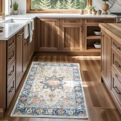 a kitchen with wooden cabinets and an area rug in front of the counter top that matches the cabinetry