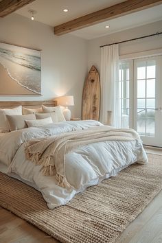 a large bed sitting in a bedroom next to a wooden headboard and window sill