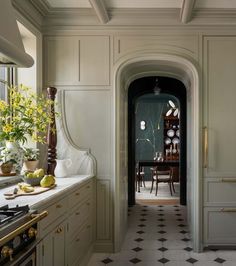 an archway leads to the kitchen and dining room