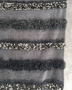 black and white striped fabric with silver sequins