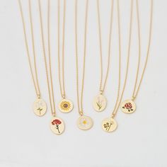 "These beautiful and dainty flower collection disk necklaces are made from 18ct gold plated metal, the pendants show different designs, choose your favorite flower your heart desires.. This is the perfect gift for you and your loved ones.❤ D E T A I L S * Delicate floral designs on circle or oval shaped disks * Each flower indicates; ▸ Lily (oval): purity & devotion ▸ Carnation (oval): love & gratitude ▸ Sunflower: loyalty & good fortune ▸ Daisy: hope & peace ▸ Tulip (oval): perf 14k Gold Filled Flower Necklace, 14k Gold-filled Flower Necklace, Dainty Flower Necklaces As A Gift For Her, Dainty Flower Necklace As Gift For Her, Dainty Flower Necklace For Her, Dainty Birth Flower Pendant Necklace, Dainty Gold Plated Birth Flower Jewelry, Delicate Gold Plated Birth Flower Jewelry, Dainty Charm Necklace With Round Disc For Mother's Day