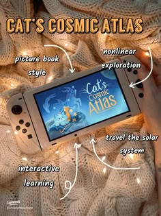 a person is holding an electronic device with the caption cats cosmic atlas on it