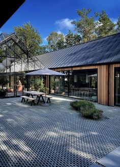 an outdoor courtyard with tables and chairs