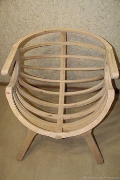 a wooden chair sitting on top of a tile floor