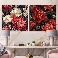 two red and white flowers are on the wall next to each other in this living room