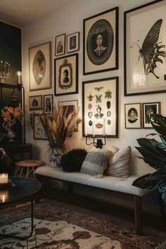 a living room filled with lots of pictures on the wall next to a white couch