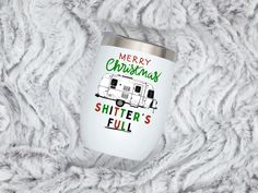 merry christmas shitter's full camper tumbler cup on white fur background