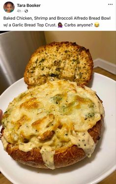 a white plate topped with bread covered in cheese