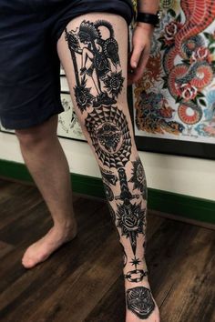 a person with tattoos on their legs