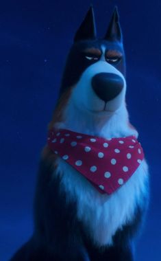 a dog wearing a red bandana with white polka dots on it's collar