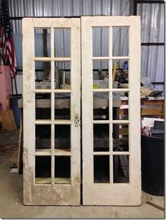 an old pair of double doors in a garage