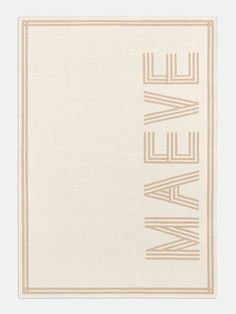 a beige and white rug with the word love in cursive letters on it