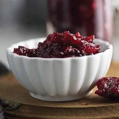 cranberry sauce in a white bowl on a cutting board