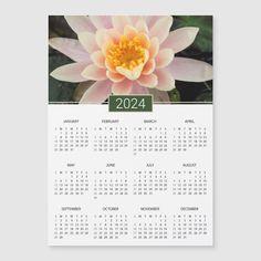 a white calendar with a pink flower on it