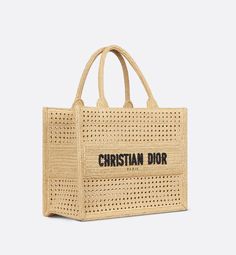 Introduced by Maria Grazia Chiuri, Creative Director of Christian Dior, the Dior Book Tote has become a staple of the Dior aesthetic. Designed to hold all the daily essentials, the style is crafted in natural Vienna straw and showcases the openwork Cannage motif. Adorned with the Christian Dior Paris signature on the front, the medium tote exemplifies the House's hallmark savoir-faire and may be carried by hand or worn over the shoulder.. Dior Aesthetic, Dior Book, Christian Dior Paris, Dior Paris, Dior Book Tote, Maria Grazia Chiuri, Maria Grazia, Medium Tote, Dior Bag