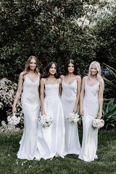 the bridesmaids are all dressed in white dresses