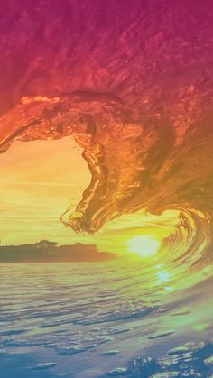 the sun is setting behind a large wave