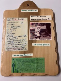 a wooden plaque with writing and pictures on it's sides, along with other items from the family collection