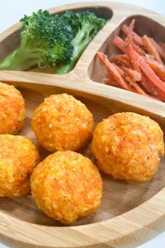 some food is on a wooden plate with carrots and broccoli