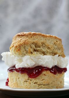 a biscuit sandwich with whipped cream and jelly