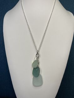 "3 piece beach glass pendant, clustered with light green, green and clear sea glass on a Sterling Silver plated 20\" cable chain.  All my beach glass pieces are from Michigan, The Outer Banks North Carolina or Barcelona, Spain.  See all my Sea glass jewelry here: https://www.etsy.com/nl/shop/MoonwaterJewelryShop?section_id=34357346 All my necklaces are different and would be considered one of a kind. See all my charm bracelets here: https://www.etsy.com/shop/MoonwaterJewelryShop?section_id=34394213  View my collection of Kingman Arizona Turquoise here: https://www.etsy.com/shop/MoonwaterJewelryShop?section_id=28192591  I've been selling on eBay since 2003 Came to Etsy to sell jewelry. Returns and exchange details ► RETURNS / EXCHANGES All items are handcrafted and custom pieces therefore w Outer Banks North Carolina, Petoskey Stone, The Outer Banks, Sea Glass Pendant, Glass Pendant Necklace, Sea Glass Jewelry, Beach Glass, Outer Banks, Selling Jewelry