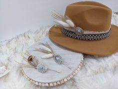 Concho Feather hat Pins!  Update your favorite western hat. Pin to shirt, jacket, purse, scarf, beanie, fedora or Bandana! Stick on your boots! Use as a lapel pin. looking for a unique Boutonniere? Or Lapel Pin. Add a pin almost anywhere!  Can be stuck anywhere. The possibilities are endless!  Choose from Boho Feather in cream, Boho Feather in tan or or Brown Feather! All pins have a stick pin back attached to add to your hat, hat band, lapel, or anywhere else you would like to add. Stick Pins: Feather Hat Pins, Unique Boutonniere, Boutonniere Pins, Hat Jewelry, Felt Cowboy Hats, Western Hat, Purse Scarf, Wedding Ring Necklaces, Boho Feathers