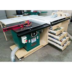 a table sawing machine with drawers underneath it