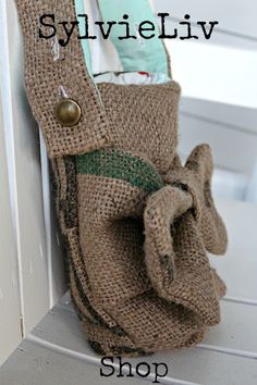 an old purse is hanging on the side of a white door with text overlay