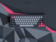 a computer keyboard sitting on top of a black and grey background with pink keys in the middle