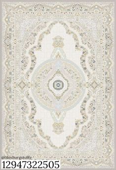 a large rug with an intricate design on the front and back side, in grey tones