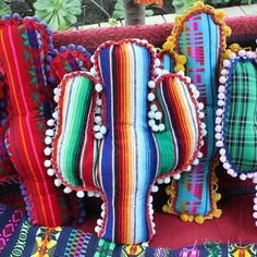 colorful bags are lined up on a table