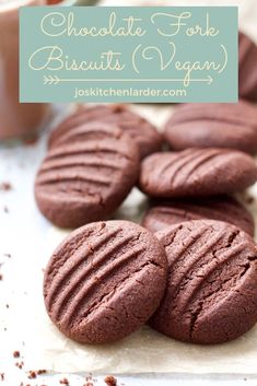 chocolate cookies are lined up on a baking sheet