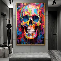 a living room with a couch and a painting on the wall that has a skull painted on it