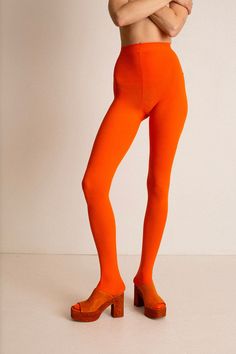 Orange opaque footed 80D tights. Reinforced crotch. Fabric is 84% Nylon, and 16% Spandex. Ella is 6' tall, 36" bust, 27.5" waist, 38" hip, and is wearing a size L/XL. See size chart below. Measurements are taken flat. These tights are extremely stretchy. For more opacity, choose the L/XL. Orange Tights, Color Tights, Color Me Badd, Waist Length, Sale Design, Tights, Size Chart, Spandex, Orange