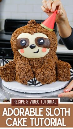 a cake with a sloth face on it and the words recipe & video tutor for adorable sloth cake