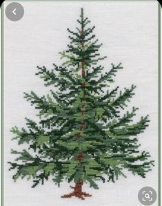 a cross stitch christmas tree with green needles