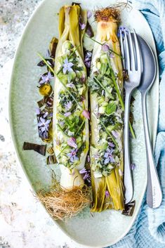 an image of food on a plate with utensils