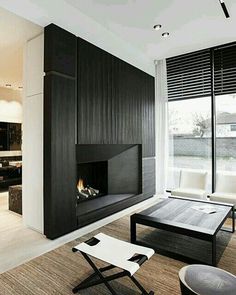 a modern living room with black and white decor