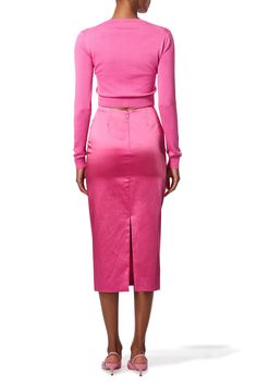 Carolina Herrera long sleeve cardigan in rose. 55%SE 45%CO Dry Clean Made in China Elegant Pink V-neck Cardigan, Chic Pink V-neck Cardigan, Feminine Fitted Long Sleeve Cardigan, Fitted Long Sleeve Feminine Cardigan, Chic Pink Sweater For Work, Chic Long Sleeve Sweater For Formal Occasions, Pink Fitted V-neck Outerwear, Elegant Pink V-neck Sweater, Pink Long Sleeve Sweater For Work