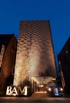 the entrance to baa4 at night, with lights on and in front of it