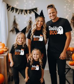 a man and two girls wearing matching halloween shirts