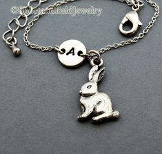 "❖ Rabbit charm: Antique silver pewter. Approx. 6/8 X 1/2\" ❖ Hand Stamped Initial Charm: Antique Silver Pewter. 3/8\" (9mm) Charms are lead free, made in U.S.A. ❖ Bracelet length: 6 & 1/4\" plus 1 & 1/2\" adjustable links = 7 & 3/4\" ❖ No extra charge up to 10\" - Contact me! ❖ Click below for Rabbit bracelet in Antique Gold Pewter: https://www.etsy.com/listing/127503126 ❖ Click below for Rabbit necklace: https://www.etsy.com/listing/114938132 ❖ Add a birthstone or Freshwater pearl Silver Initial Bracelet, Pizza Necklace, Bunny Jewelry, Rabbit Necklace, Rabbit Charm, Bracelet Initial, Bracelet Friendship, Initial Bracelet, Initial Charm