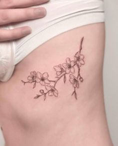 a woman's stomach with flowers on it