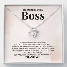 a necklace with the words to an incredible boss on it in a white box that says thank you