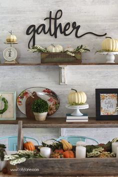 the shelves are decorated with pumpkins, gourds and other fall decor items