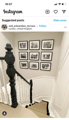 the stairs in this house are lined with pictures