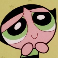 the powerpuff girls cartoon character with big eyes and black hair is looking at something