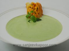 a white plate topped with soup and vegetables